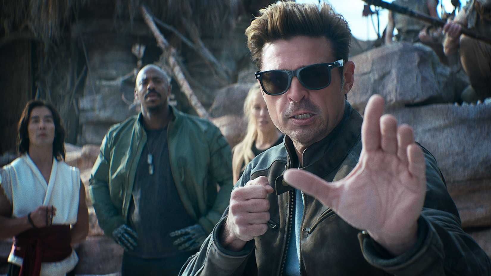 Mortal Kombat II's Ludi Lin as Liu Kang, Mehcad Brooks as Jackson 'Jax' Briggs, Jessica McNamee as Sonya Blade, and Karl Urban as Johnny Cage