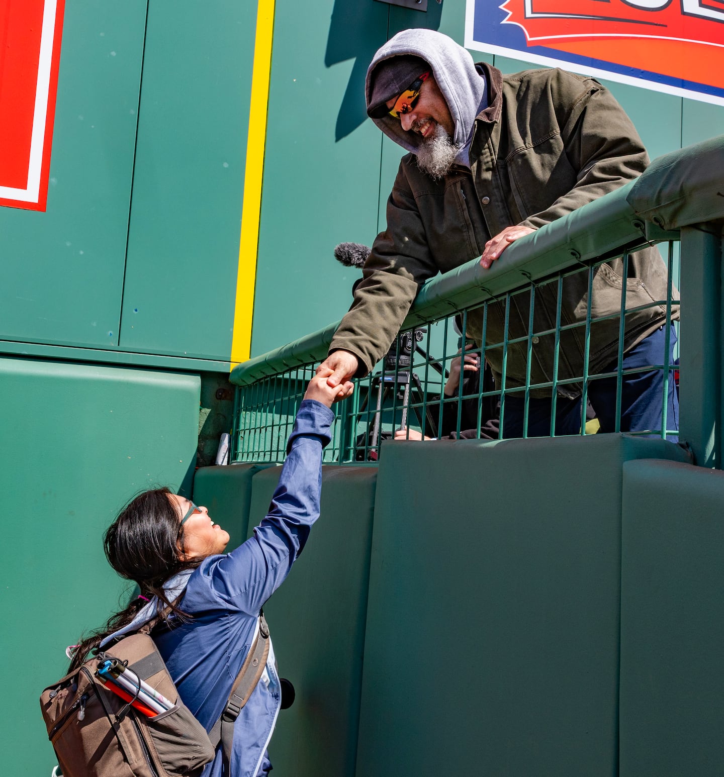 Caruso greets Achilles International adaptive running coach Joe Lumar, who calls. "A shining light that inspires." She recently completed a Boston Athletic Association 5K run with a guide.