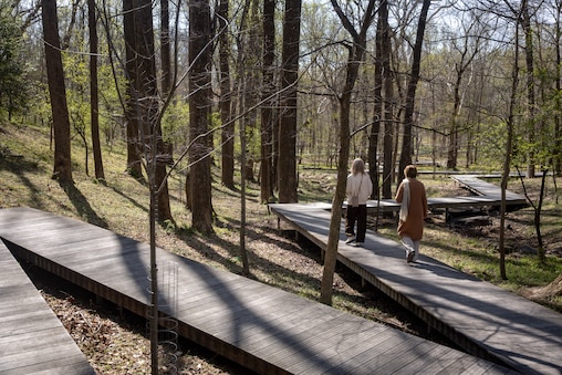 Thursday, April 9, 2026 - Visitors walk along the boardwalk on the grounds of Glenstone Museum.