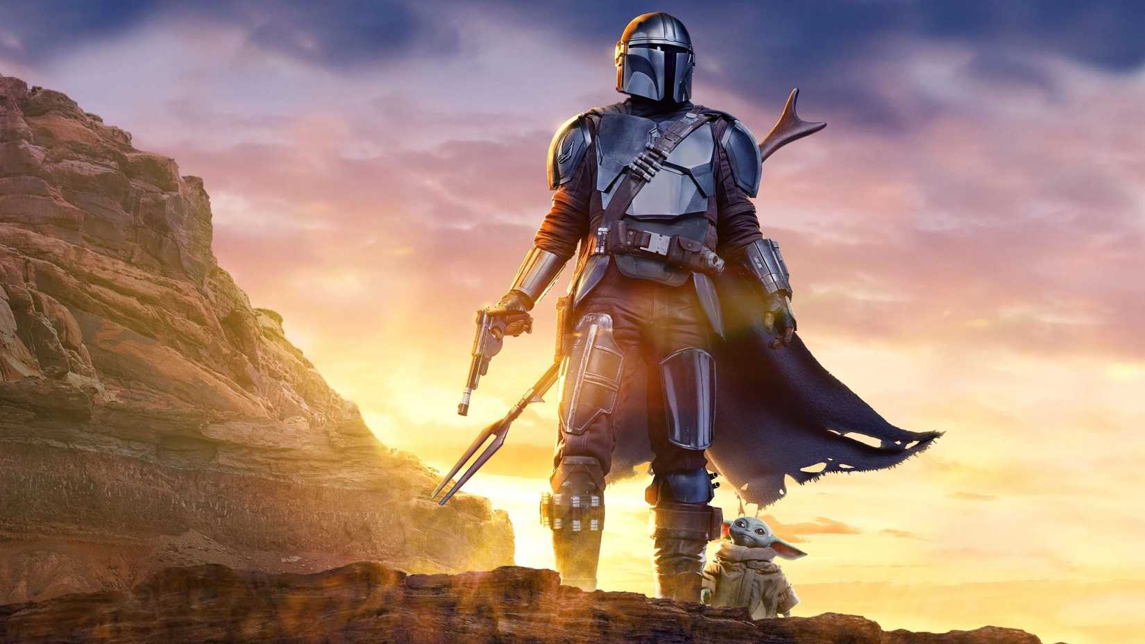 Star Wars: The Mandalorian and Grogu promotional art featuring Grogu and Din Djarin.