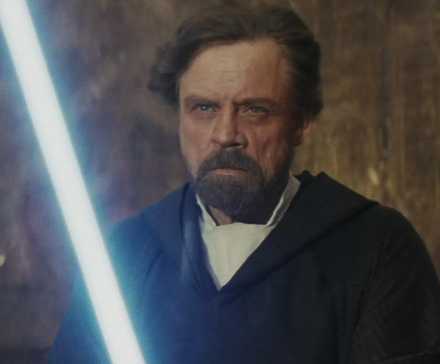 Luke holding a lightsaber in The Last Jedi