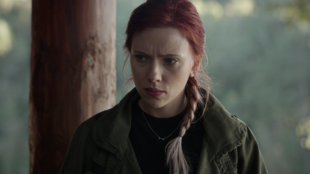 In a scene from Avengers: Endgame, Natasha Romanoff (aka Black Widow) looks sad and has her hair tied up in two-tone braids.