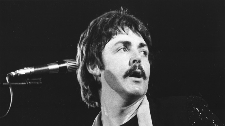 Paul McCartney on stage with mustache
