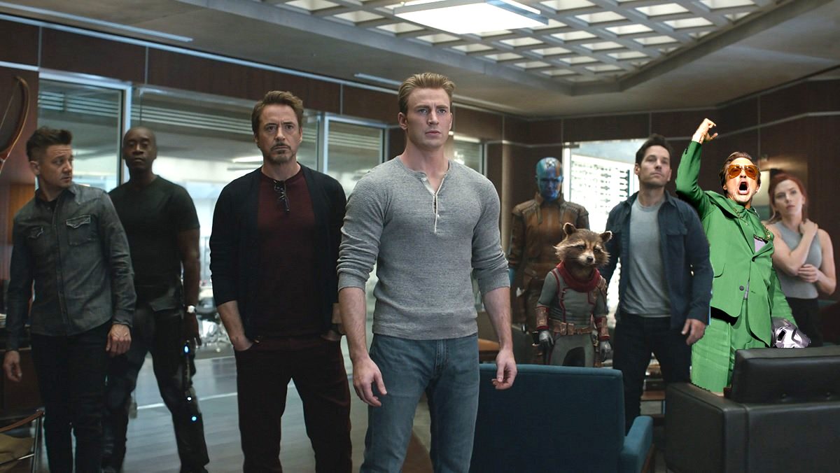 The Avengers stand nervously in the room, and Robert Downey Jr., wearing a photoshopped green suit, screams.