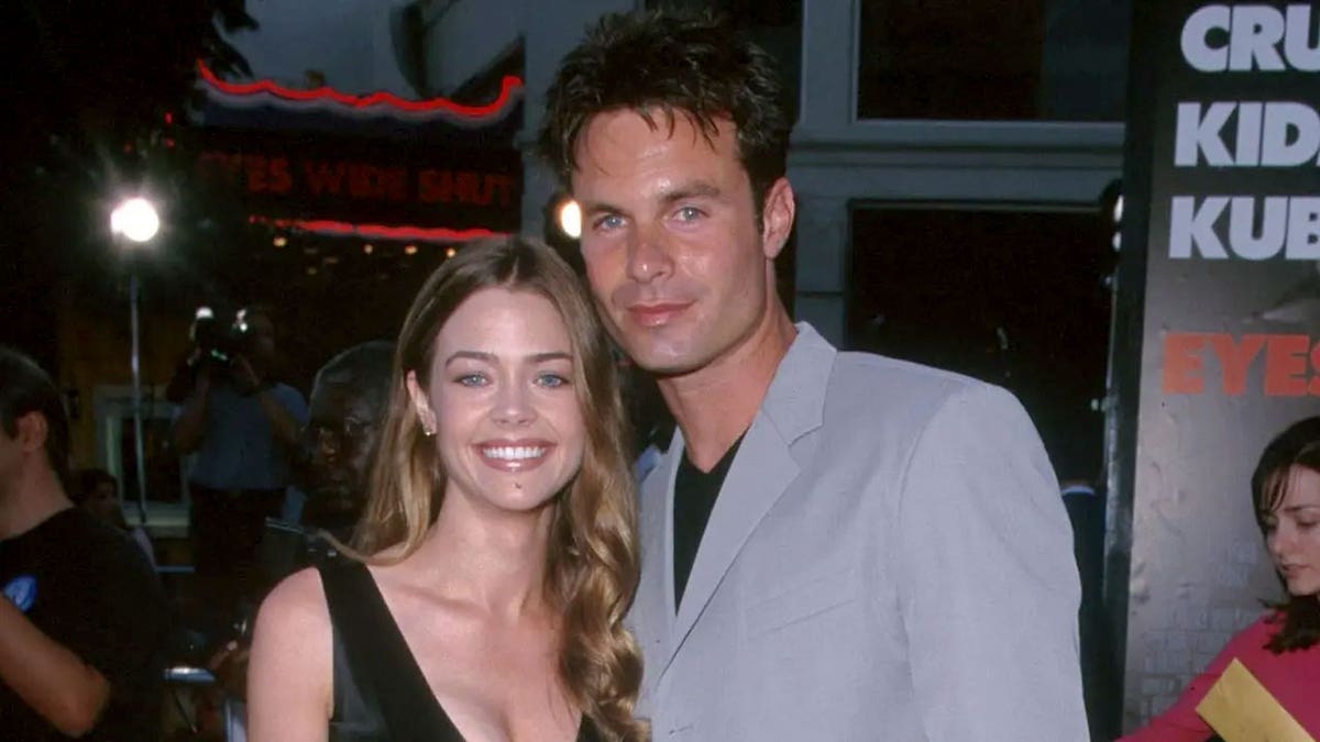 Denise Richards and Patrick Muldoon smile and pose together