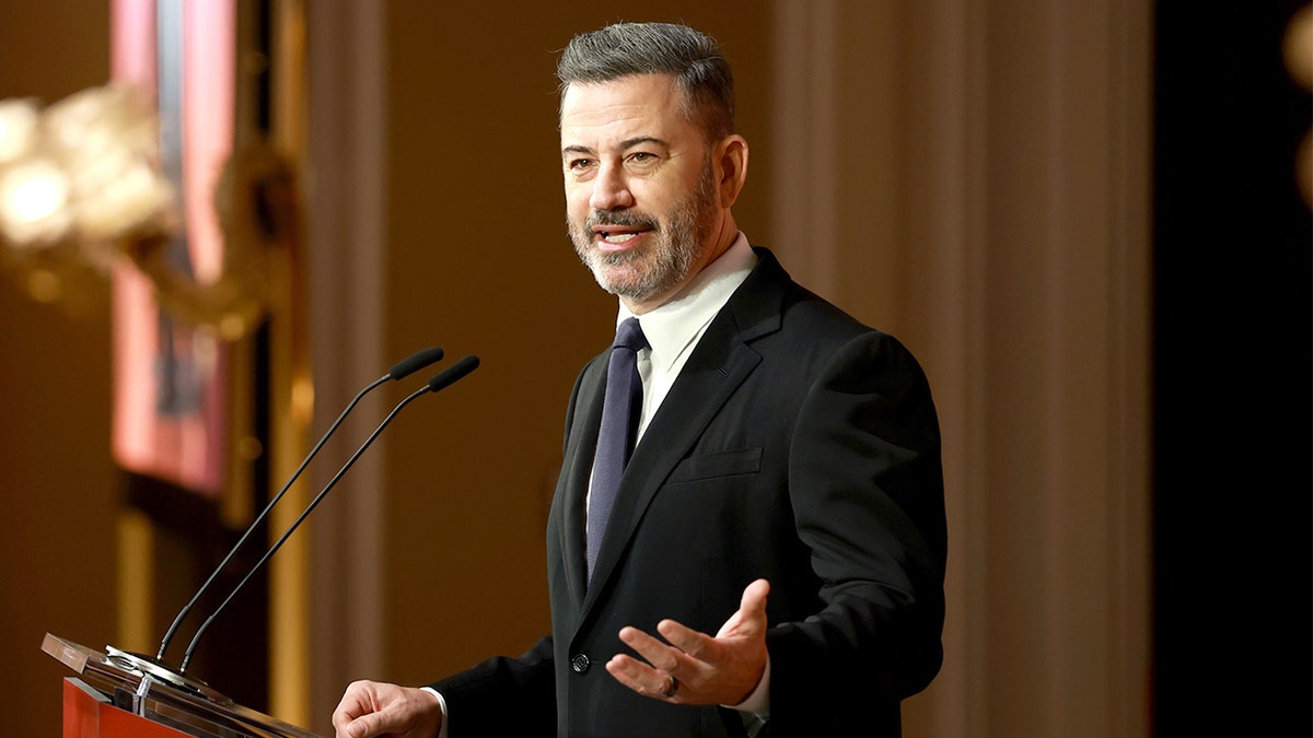 Jimmy Kimmel speaks on stage at The Hollywood Reporter's Women in Entertainment event in Beverly Hills.