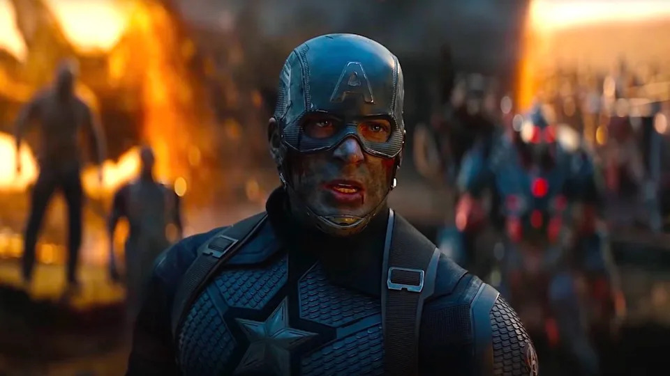 Chris Evans' Captain America stands in front of a portal in Avengers: Endgame.